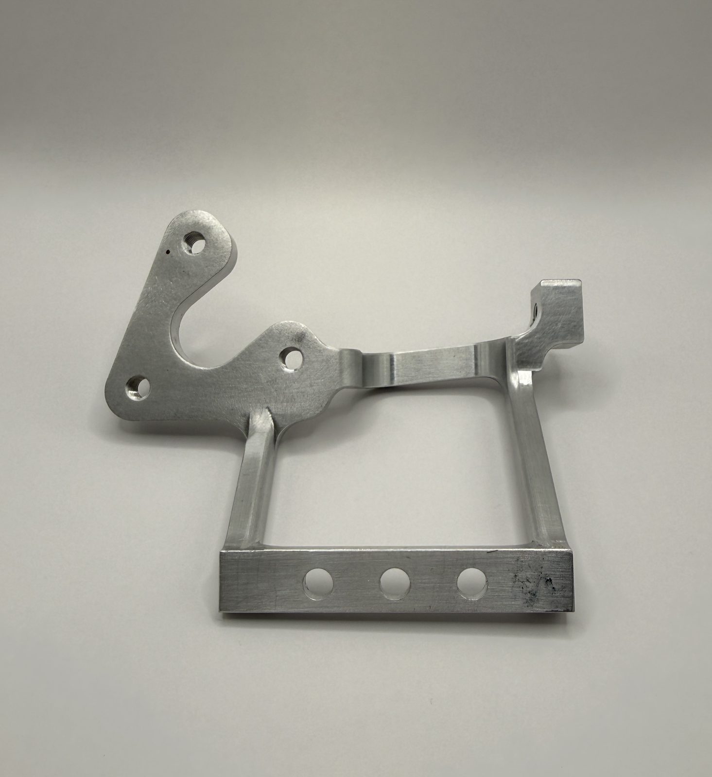 Machined aluminum bracket produced by Proaxxis