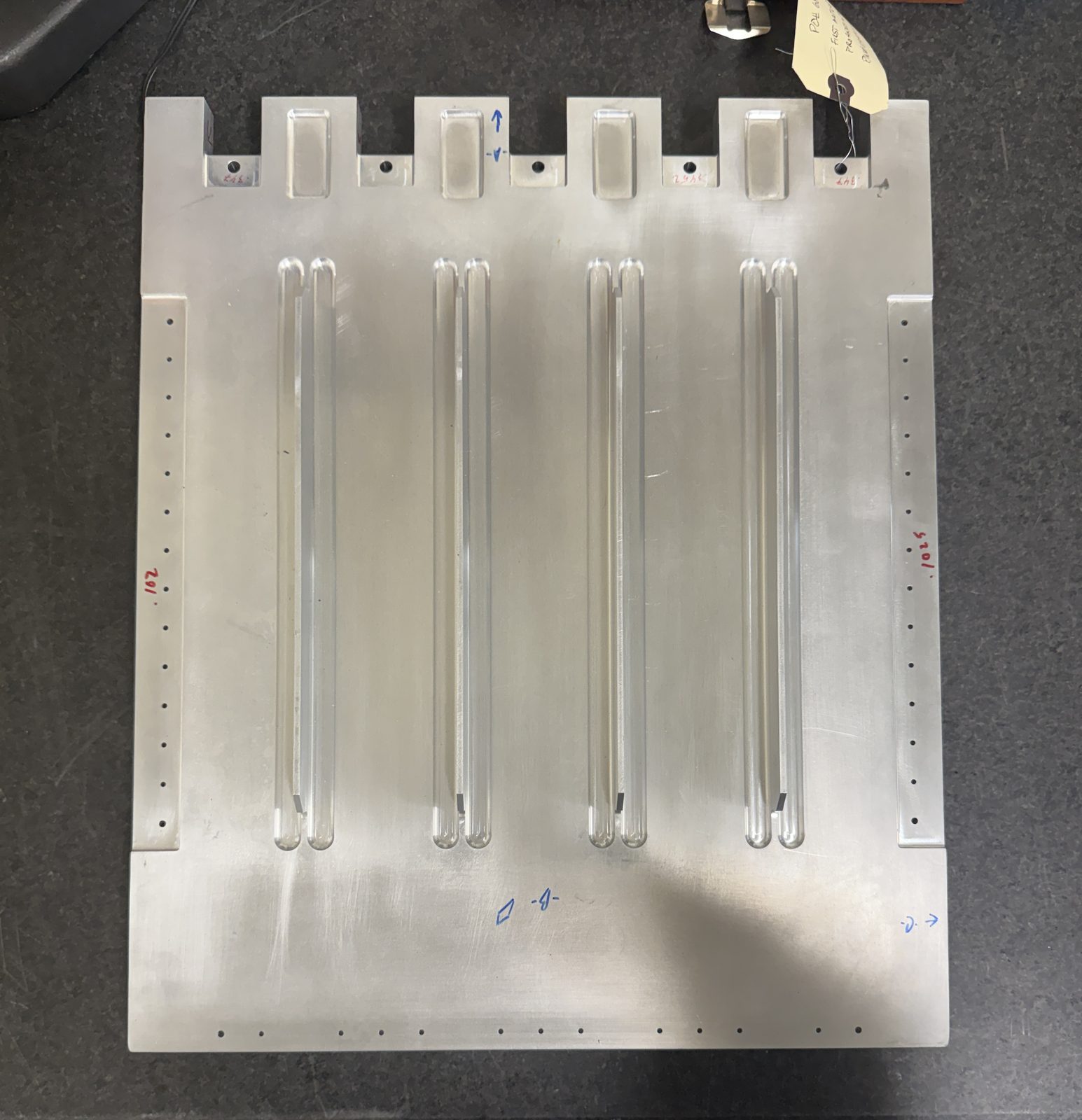 Machined aluminum plate on the granite surface plate during first article inspection