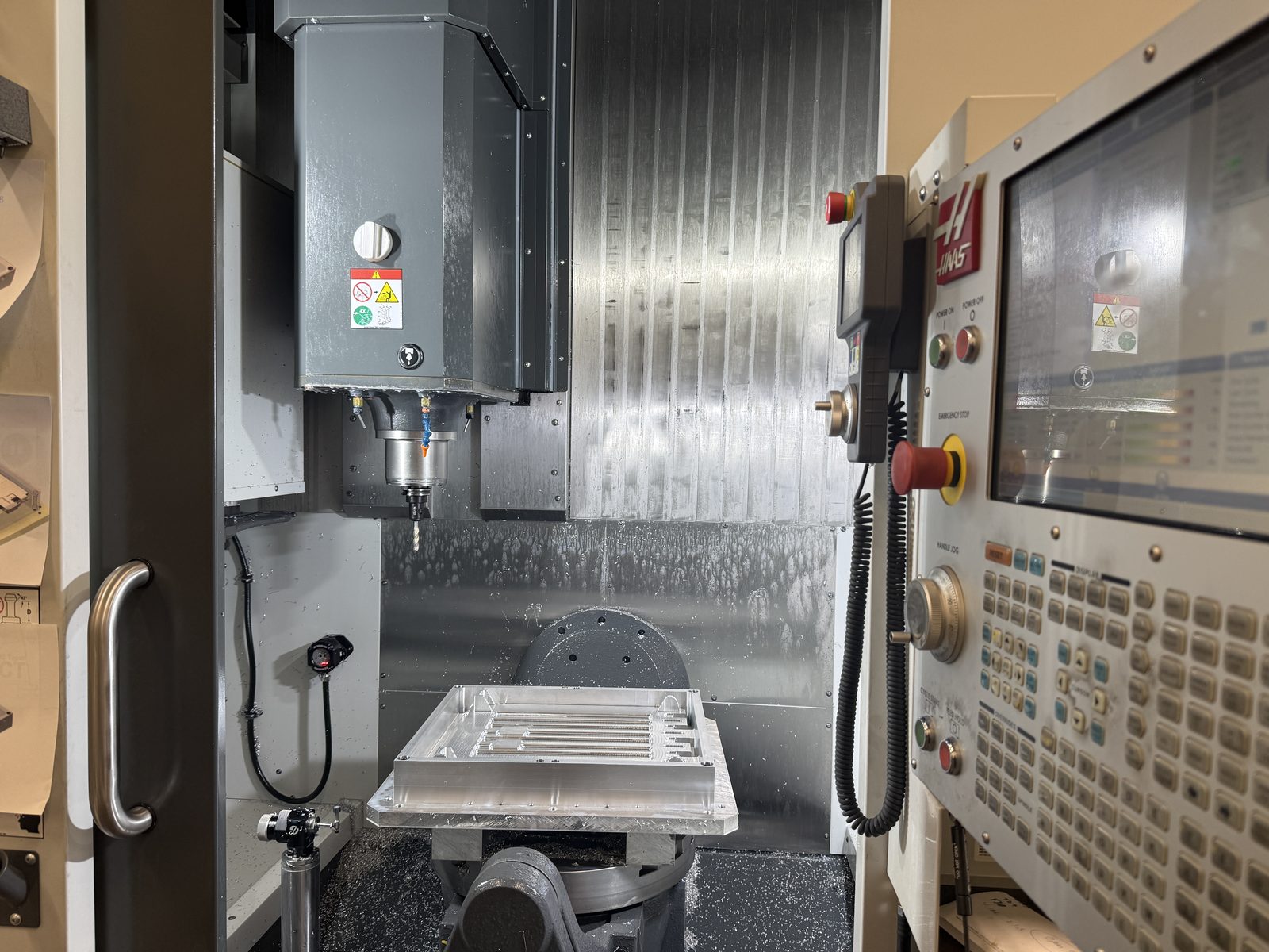 Inside the Haas UMC-750 5-axis machining center with a fixtured aluminum workpiece